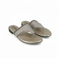 A pair of women's thong sandals with metallic gold flat feet and glittery beige straps, shown on a white studio background.