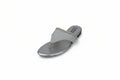 A single silver metallic thong sandal with a glittery strap and a low flat heel, photographed on a light gray background.