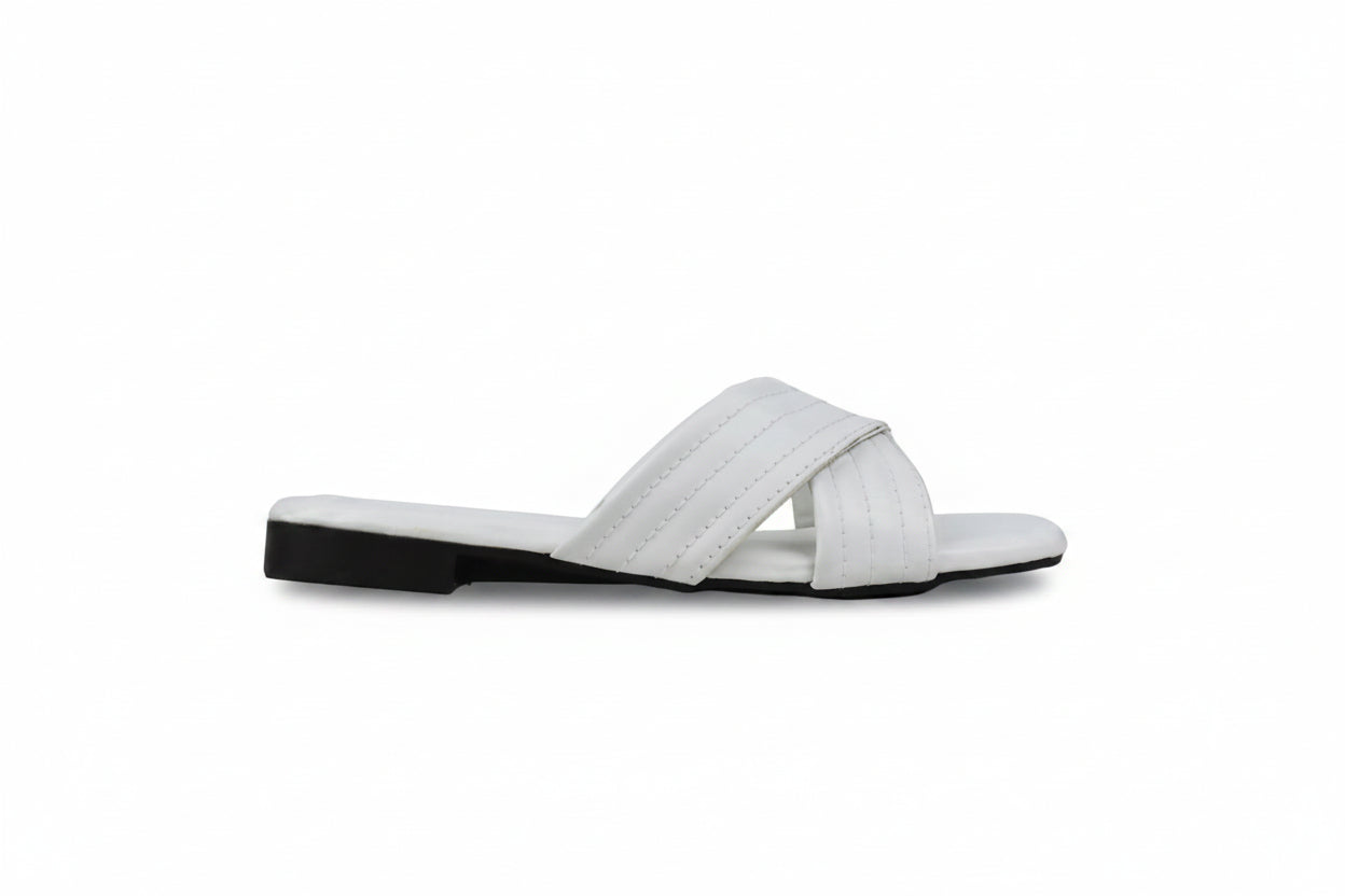 A single white leather slide sandal with a low black heel, shown in profile against a light gray background.