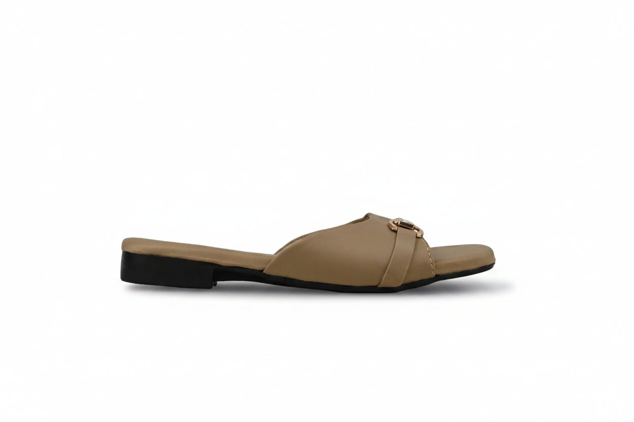 A single tan leather slide sandal with a low black heel and a small gold buckle detail on the strap, shown in profile against a light gray background.