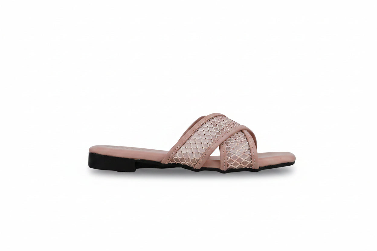 A single women's flat slide sandal in a dusty pink color, featuring a textured openwork woven pattern across the upper straps and a solid pink footbed, set against a light gray background.