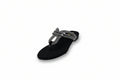 A single black thong sandal with a decorative woven strap featuring black and white stripes and a small gold logo, photographed on a white studio background.