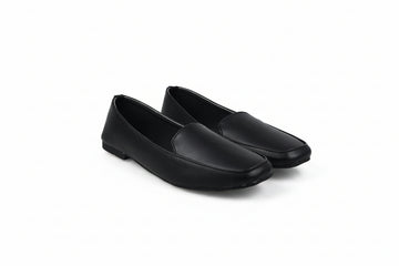 A pair of black leather slip-on loafers with square toes, displayed on a light gray studio background.