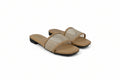 A pair of women's slide sandals with beige woven mesh straps and tan soles, photographed on a light gray studio background.