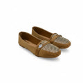 A pair of tan flat loafers with woven pattern toe caps and a small silver rhinestone buckle, displayed on a white studio background.