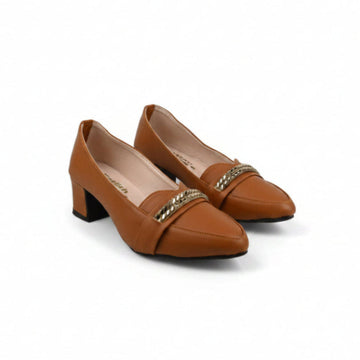 A pair of women's brown leather block-heel pumps with pointed toes and a gold-tone chain detail across the vamp, displayed on a light gray studio background.