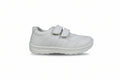 A white low-top casual shoe with two hook-and-loop strap closures, shown from the side against a light gray textured background.