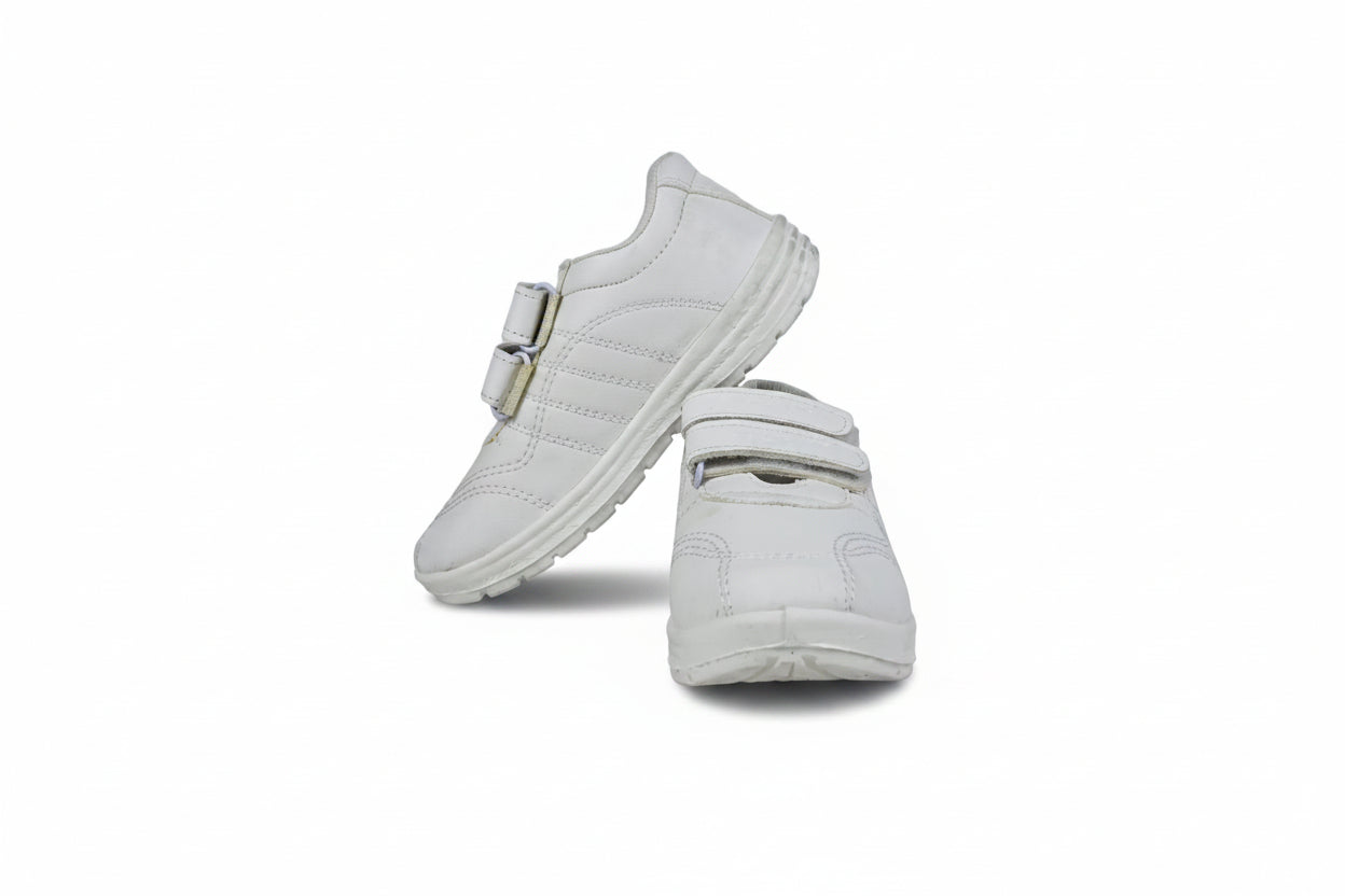 A pair of white low-top casual shoes with double hook-and-loop strap closures, displayed on a light gray studio background.