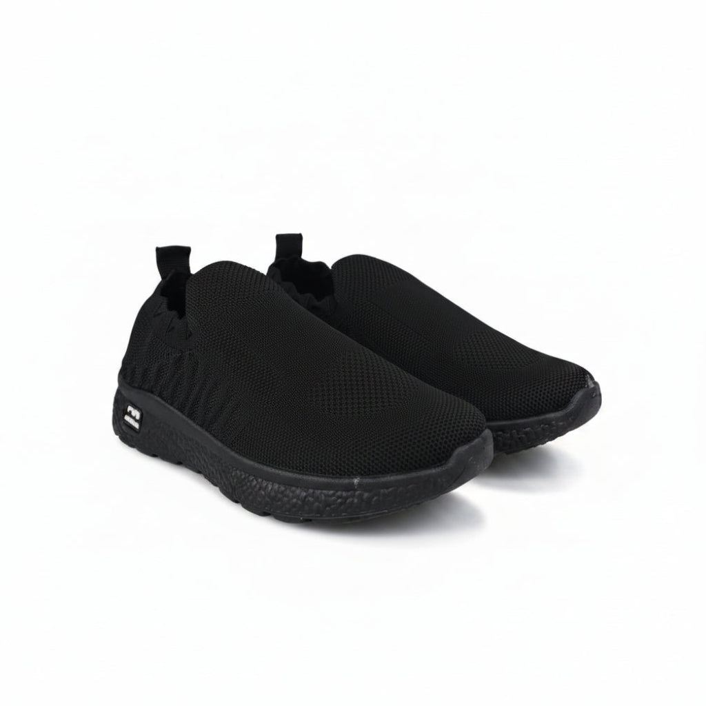 A pair of black slip-on mesh sneakers with a textured knit upper and black soles, displayed on a light gray background.