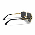 A pair of gold-framed aviator sunglasses with dark lenses and black temple tips, displayed on a light gray surface with a textured black pouch on each side.
