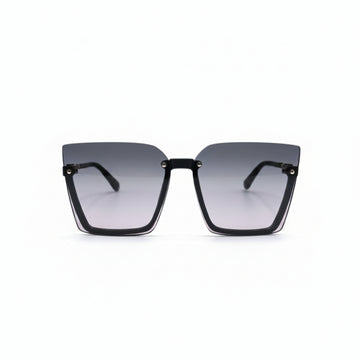 A pair of square-frame sunglasses with a black acetate frame and gradient pink-tinted lenses, displayed on a white surface between two silver studio reflectors.