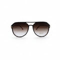 Dior aviator sunglasses with dark brown gradient lenses and gold metal frames, displayed on a white surface between two silver textured panels.