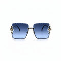 Square sunglasses with blue gradient lenses and ornate gold-toned metal accents on the sides, displayed against a white background with reflective silver panels on either side.