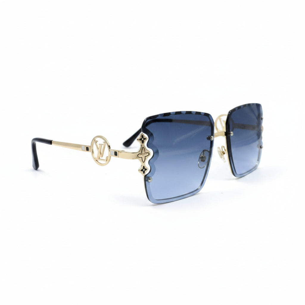 Louis Vuitton square sunglasses with blue gradient lenses, gold metal frames, and the iconic LV monogram on the bridge, displayed on a white surface with textured gray props on either side.