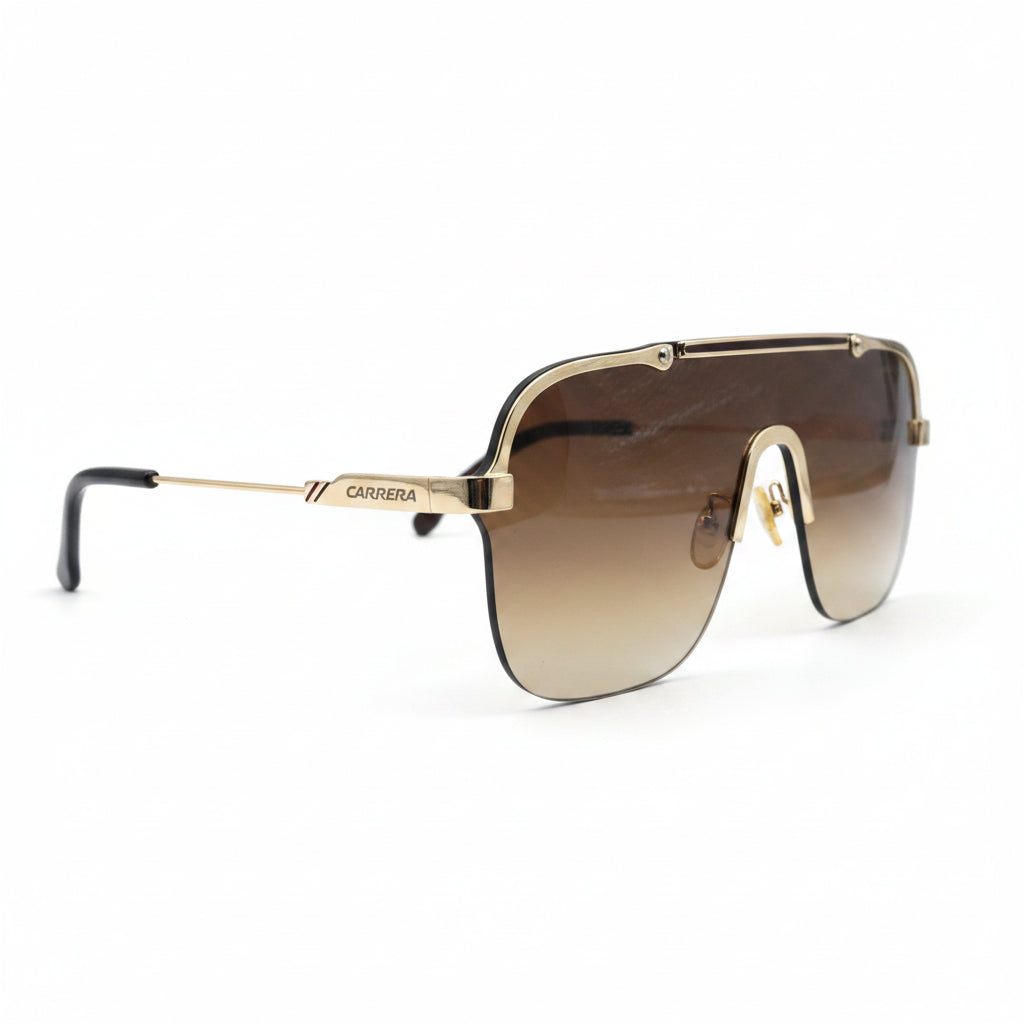 A pair of oversized square aviator-style sunglasses with a gold metal frame and gradient brown lenses, displayed on a white surface with a black textured backdrop visible on the sides.
