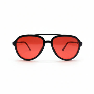 A pair of aviator-style sunglasses with a matte black frame and vibrant red lenses, displayed on a white surface between two textured silver pouches.