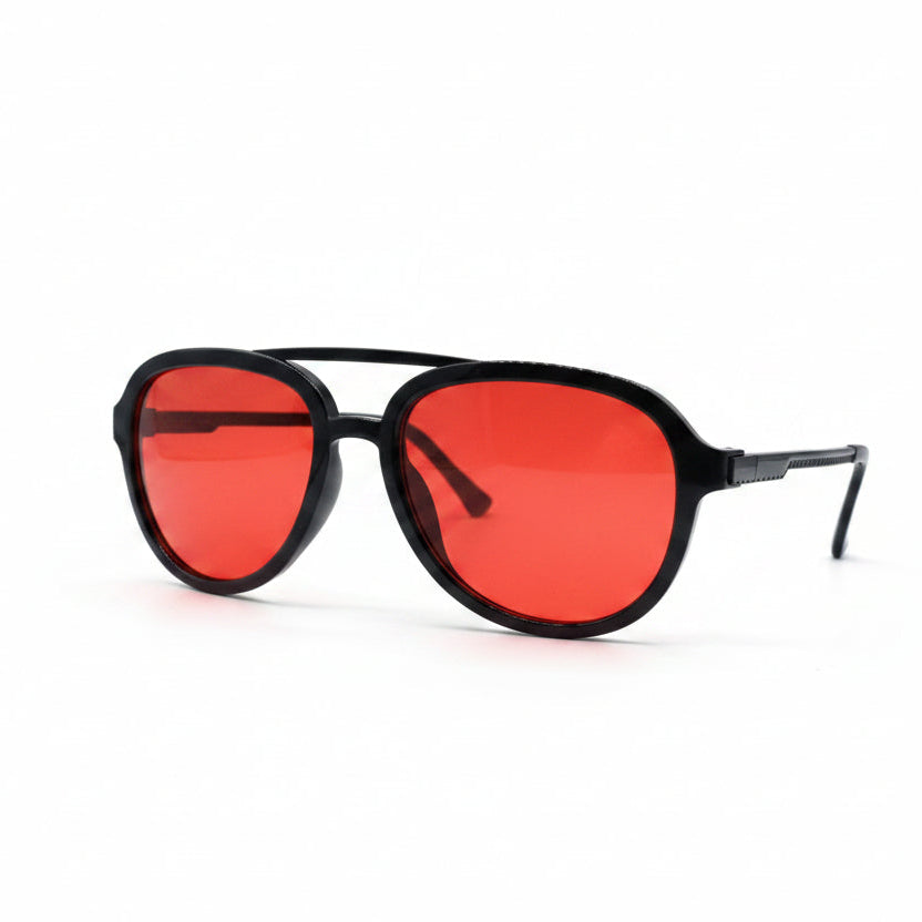 A pair of aviator-style sunglasses with a matte black frame and vibrant red lenses, displayed on a white surface between two textured silver pouches.