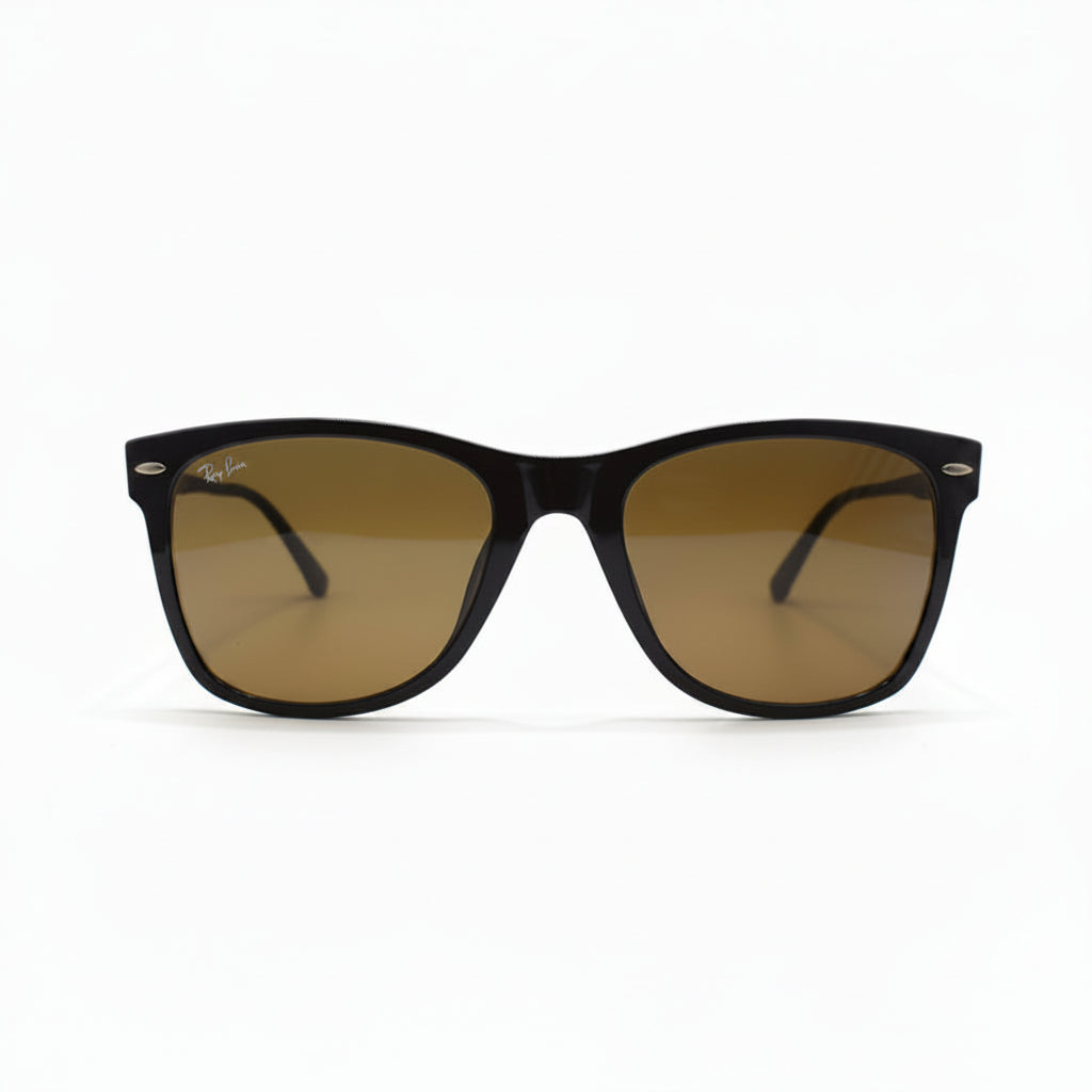 A pair of classic Wayfarer-style sunglasses with a dark brown acetate frame and warm brown-tinted lenses, displayed on a white surface with a reflective silver backdrop.
