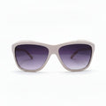 A pair of oversized square sunglasses with a light pink frame and dark purple gradient lenses, displayed on a white surface with soft studio lighting.