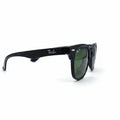 Ray-Ban Wayfarer sunglasses with a black acetate frame and dark green lenses, displayed on a white surface with softbox lighting.