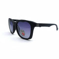 A pair of black sunglasses with purple-tinted lenses, shown on a white surface with a soft shadow. A small sticker is visible on the lower left lens.