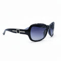 A pair of black sunglasses with dark gray gradient lenses and a silver-tone decorative buckle on the temple arm, displayed on a white surface with a reflective silver backdrop.