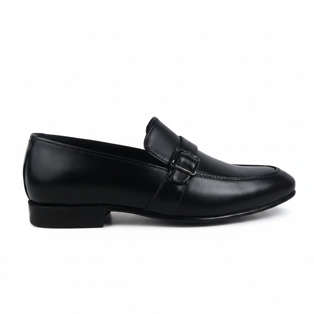 A single black leather loafer with a low block heel and a decorative strap detail across the instep, shown in profile against a light gray fabric backdrop.