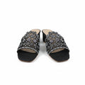 A pair of women's black mule sandals with chunky block heels and wide straps heavily embellished with silver rhinestones, shown on a white studio background.
