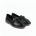 A pair of black croc-embossed leather loafers with silver buckle details and tan soles, displayed on a white studio background.