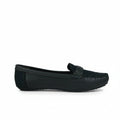 A single black leather penny loafer shown in profile against a light gray fabric backdrop.