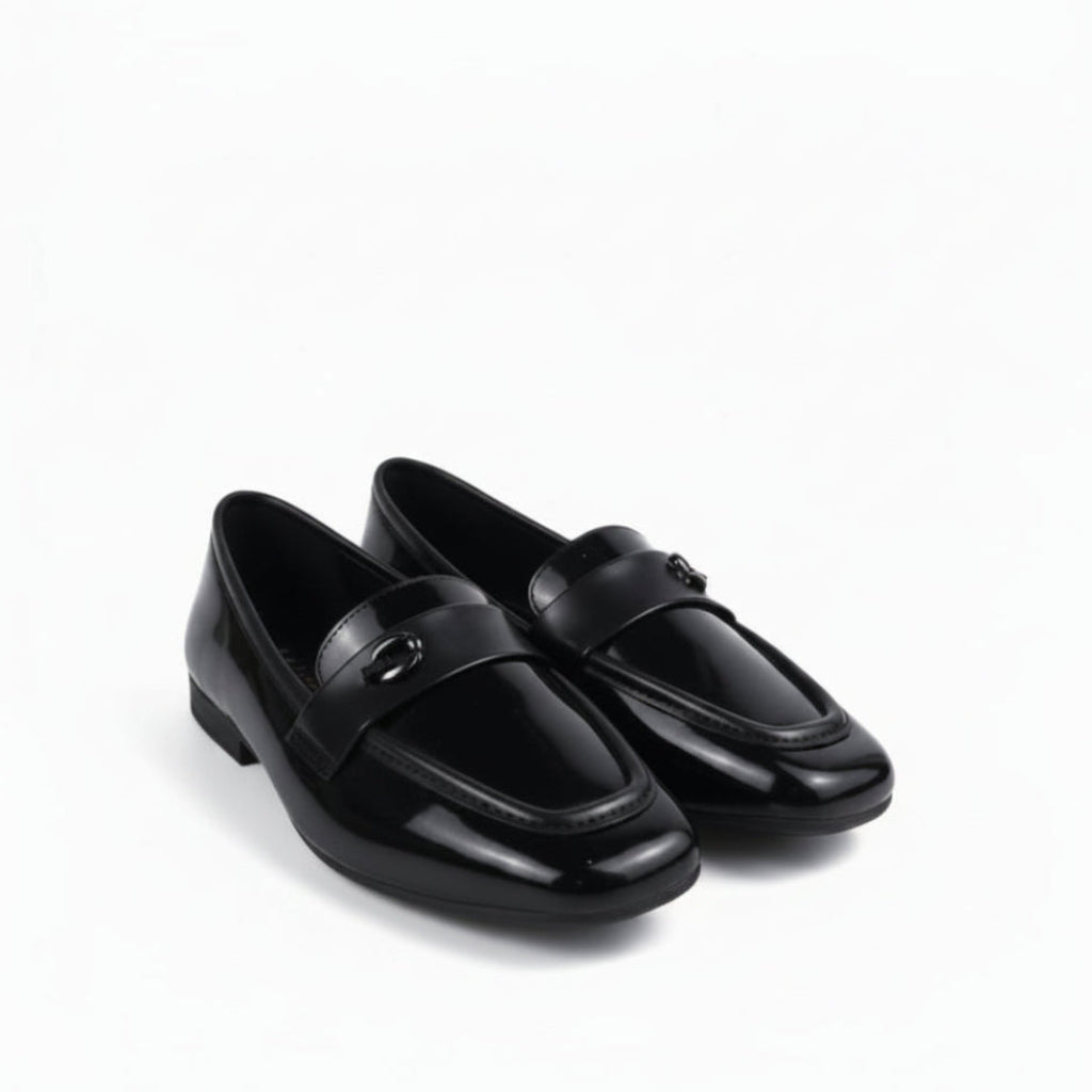 A pair of glossy black patent leather loafers with a small silver-tone horsebit detail on the strap, displayed on a white studio background.