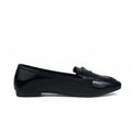 A single black patent leather loafer flat shown in profile against a light gray textured background.