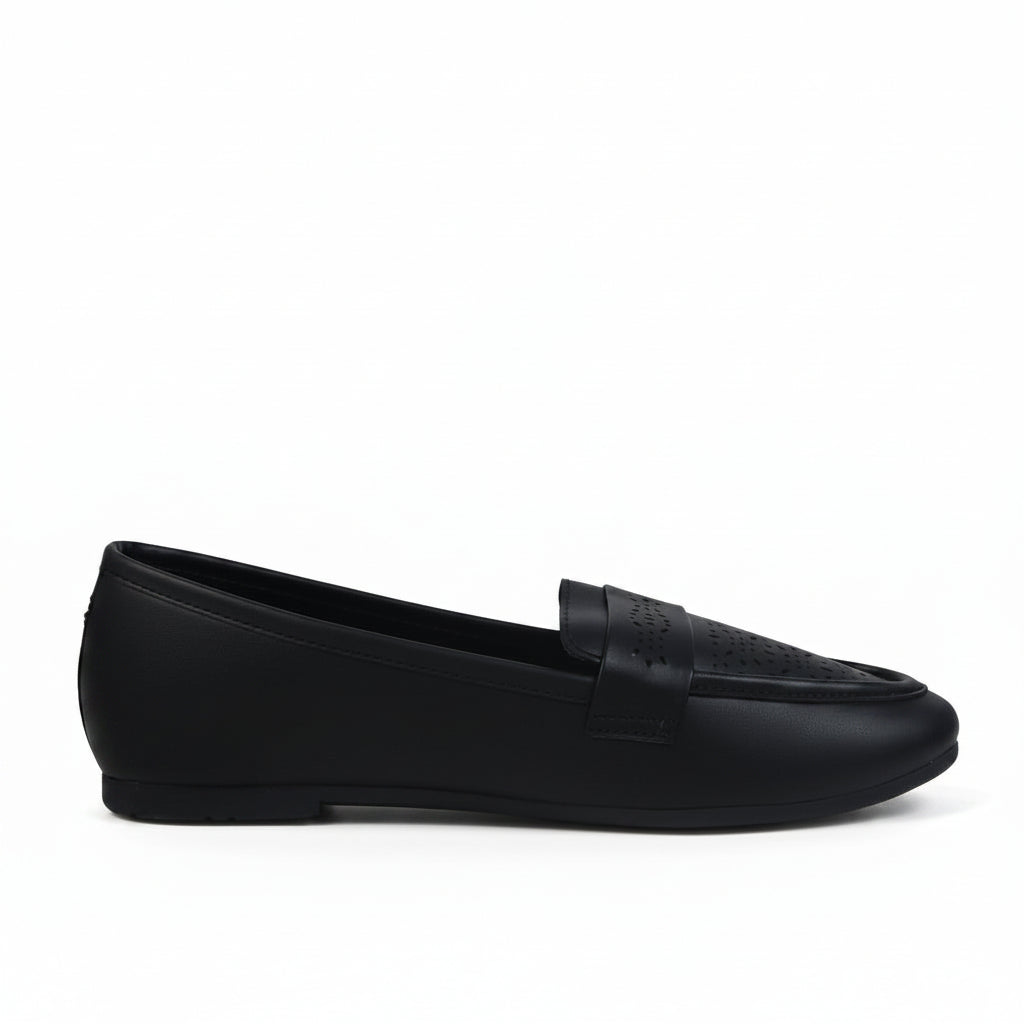 A single black leather slip-on loafer shown in profile against a light gray textured studio background.