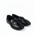 A pair of glossy black patent leather penny loafers with decorative straps across the vamp, displayed on a white studio background.