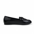 A single black patent leather penny loafer shown in profile against a light gray background.