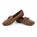 A pair of brown leather penny loafers with small silver-tone metal hardware on the vamp, displayed against a white studio background.
