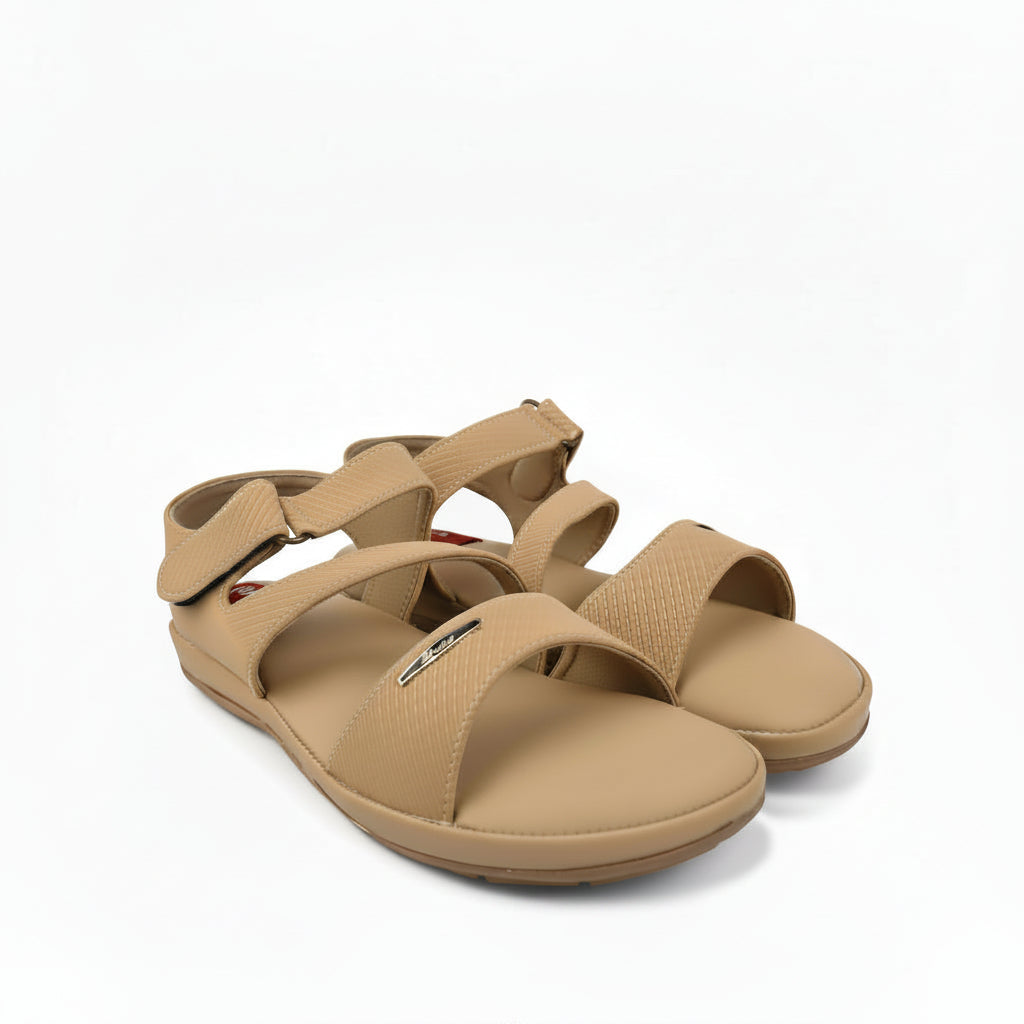 A pair of tan woven strappy sandals with adjustable straps, displayed on a white studio background.