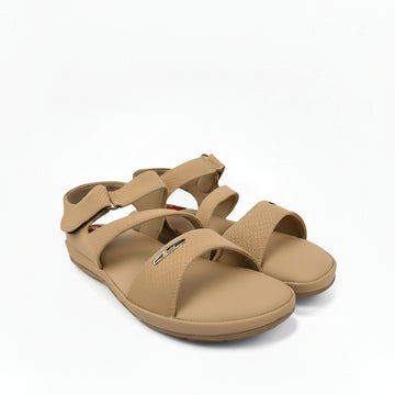 A pair of tan woven strappy sandals with adjustable straps, displayed on a white studio background.