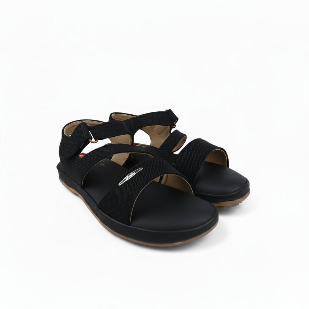 A pair of black platform sandals with textured straps and adjustable buckles, photographed on a white studio background.
