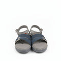 A pair of women's casual sandals with gray soles and straps, featuring textured blue straps across the foot, shown next to their red and black Posh's shoebox on a white background.