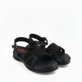 A pair of black athletic sandals with textured mesh straps and adjustable ankle buckles, photographed on a white studio background.