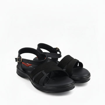A pair of black athletic sandals with textured mesh straps and adjustable ankle buckles, photographed on a white studio background.