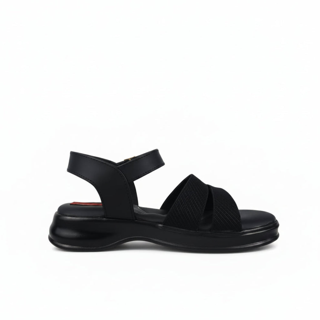 A pair of black athletic sandals with textured mesh straps and adjustable ankle buckles, photographed on a white studio background.