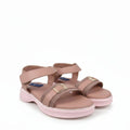 A pair of women's platform sandals in a dusty rose pink color, featuring double straps with gold-tone buckles and a blue brand label on the side, set against a light gray background.