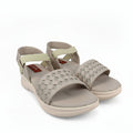 A pair of women's casual slide sandals with woven pattern straps and adjustable ankle straps, shown on a light gray background.