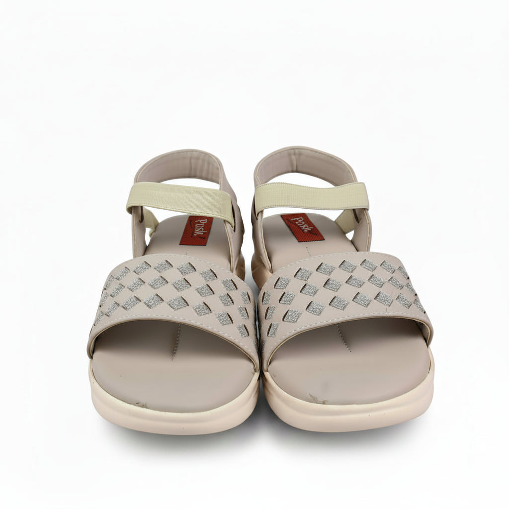 A pair of woven beige sandals with pale yellow straps, shown next to a red Mettler box on a white surface.