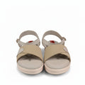 A pair of beige platform sandals with textured woven straps and adjustable ankle straps, shown next to a red and black shoebox with the brand name 'Posh' visible.