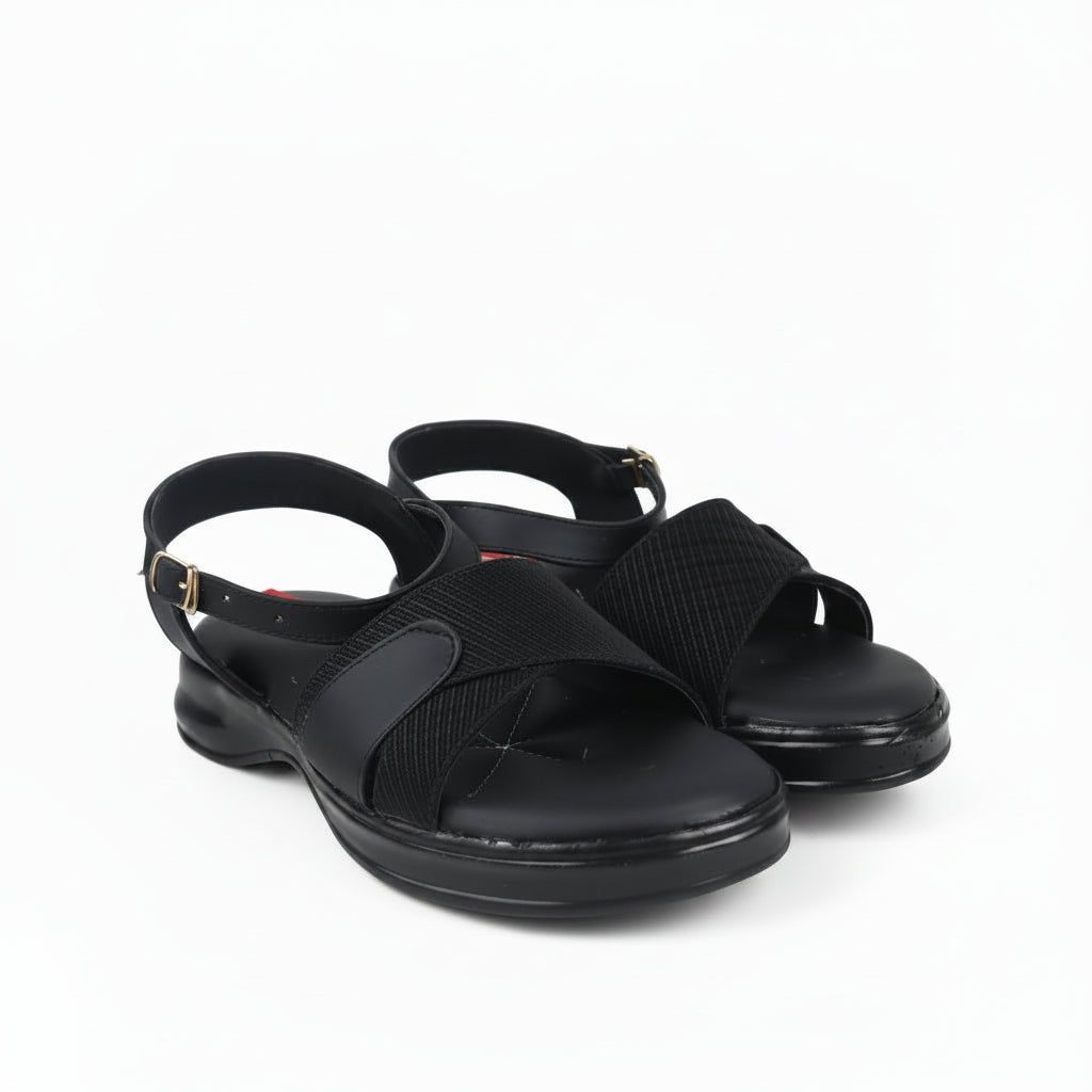 A pair of black women's slingback sandals with textured straps and low block heels, photographed on a white studio background.