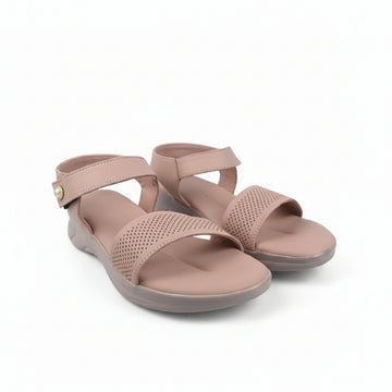 A pair of women's wedge sandals in a dusty pink color, featuring perforated straps and a small gold button detail on the ankle strap, set against a plain light gray background.