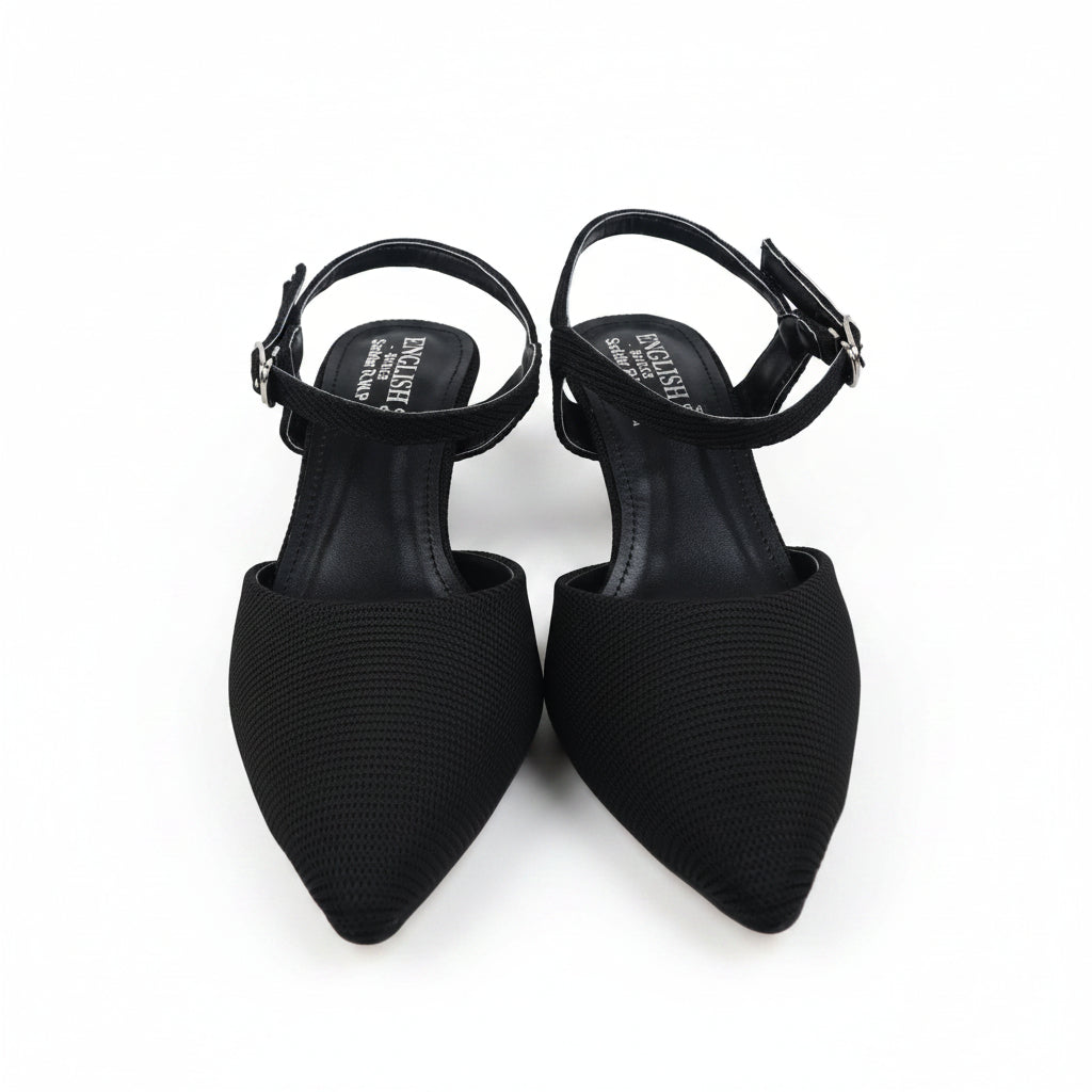 A pair of black pointed-toe slingback pumps with ankle straps and chunky block heels, photographed on a white studio background.